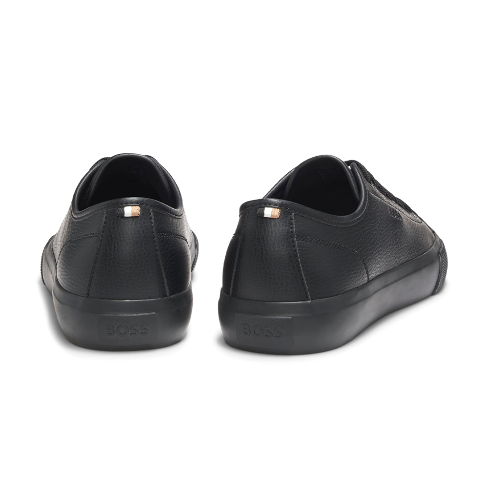 Low-top trainers in grained faux leather.